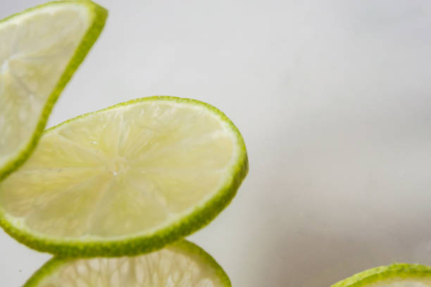 istock Refreshing water with slices of lime 974745592