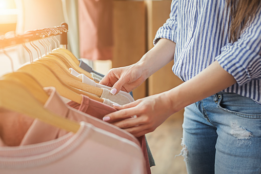 Smiling Girl Bying Clothes In Showroom Stock Photo - Download Image Now -  Clothing, Retail, Shopping - iStock
