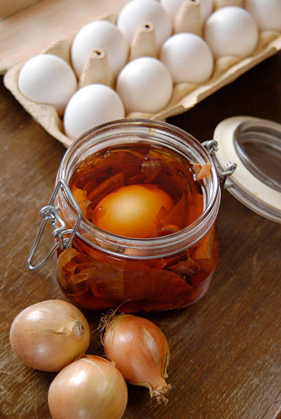 Dyeing eastereggs with onion shells stock photo