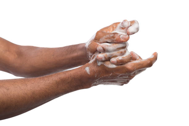 istock Black man washing hands isolated on white background 974758198