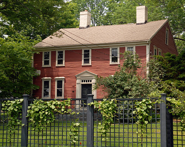 Salem, Massachusetts, USA - 13 June 2015 - a historic house in Salem, seen behind an iron fence