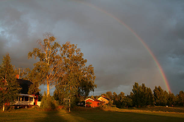 Swedish house with rainbow stock photo