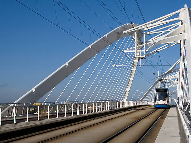 Tram on a modern bridge stock photo