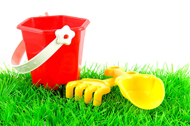 istock Sandpit toys on green grass 97477355