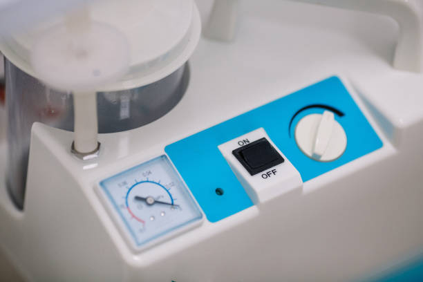istock Sputum suction devices for patients. Basic Suction Pump, surgical suction device in medical operating room 974778812