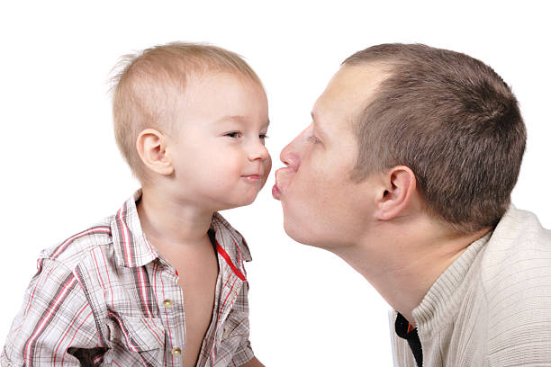 istock Daddy kisses his little son 97477999