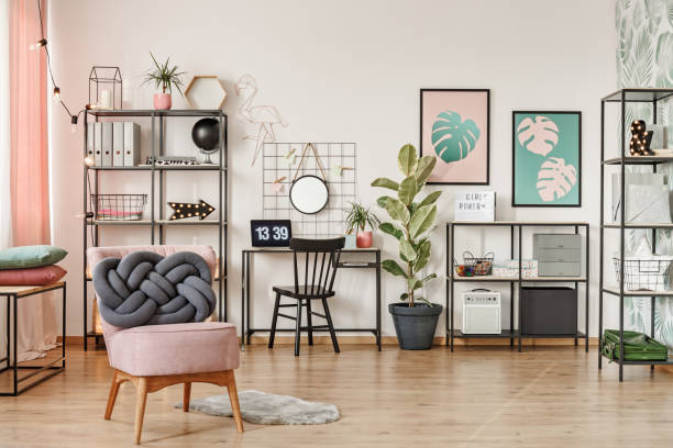 istock Pink armchair in workspace interior 974784836