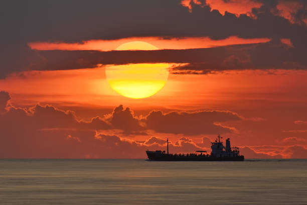big sun and big boat on the sea from bangpu thailand