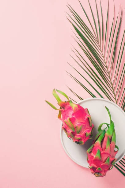 istock Fresh pitahaya close up on pink background, pastel minimalism 974790852