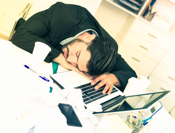 istock Businessman is resting after productive work day 974790894