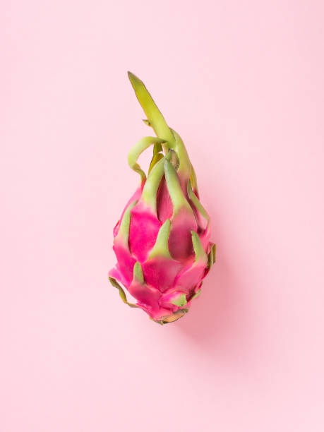 istock Fresh pitahaya close up on pink background, pastel minimalism 974791014