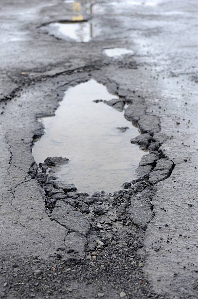 istock Pot hole full of water 97479414
