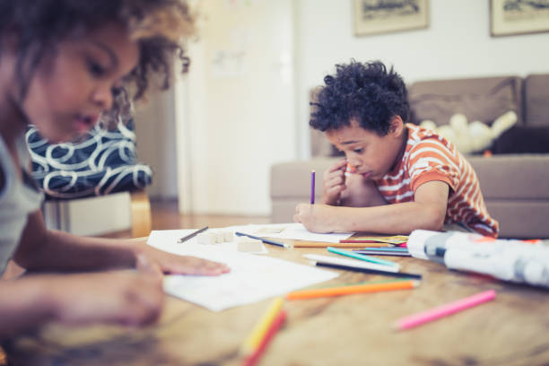 istock Cute mixed - race siblings playing at home 974796122