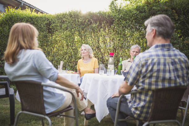 istock Senior people, friends having fun, enjoying backyard barbecue 974807048