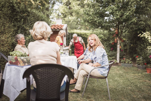 istock Senior people, friends having fun, enjoying backyard barbecue 974807164