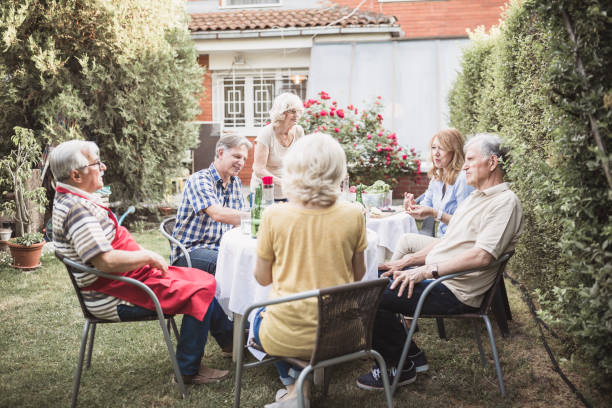 istock Senior people, friends having fun, enjoying backyard barbecue 974811562
