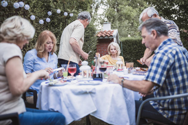 istock Senior people, friends having fun, enjoying backyard barbecue 974811768