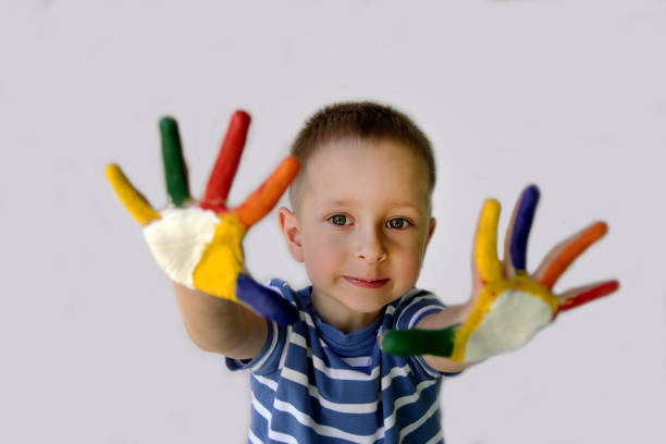 istock Cute little boy with painted hands 974813180