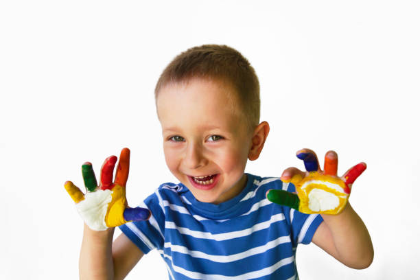 istock Cute little boy with painted hands 974813184
