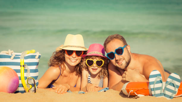 istock Family at the beach 974813370