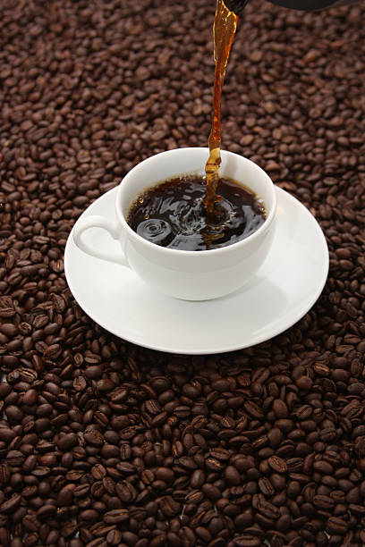 istock Pouring Fresh Brewed Coffee Into Classic White Cup 97481501