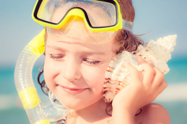 istock Happy child on the beach 974815536