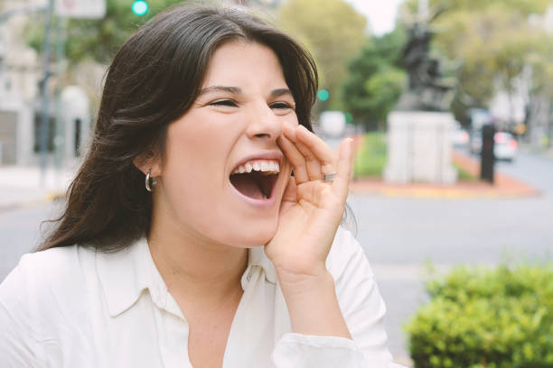 istock Handsome young woman screaming 974815938