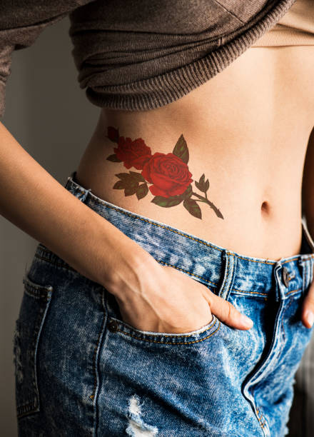 Closeup Of Lower Hip Tattoo Of A Woman Stock Photo - Download Image Now -  Tattoo, Women, Hip - Body Part - iStock