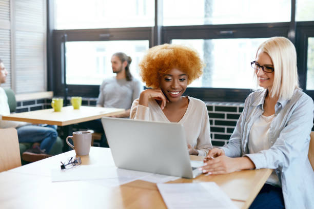 istock Business Women Working In Cafe 974819796