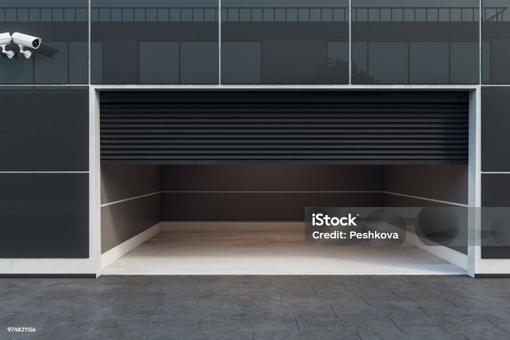 Empty garage interior Front view of empty garage interior with camera and copy space. 3D Rendering Garage Stock Photo