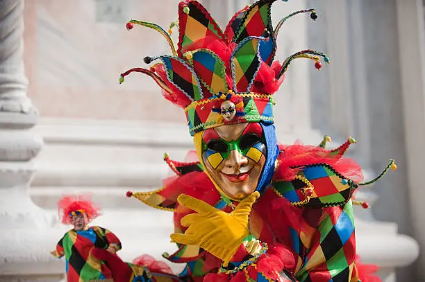 Beautiful outfit of a clown at the famous carnival of the masks in Venice, Italy