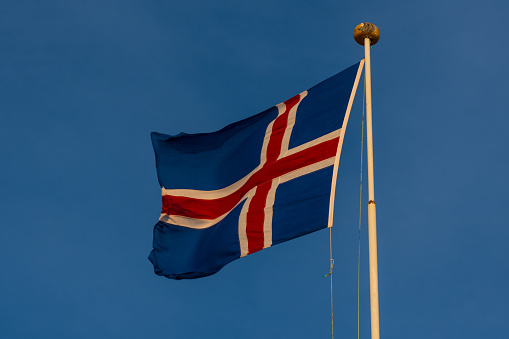 Icelandic flag waving on a flag post