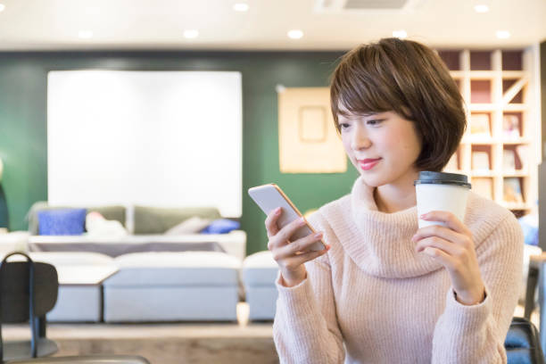 istock A woman relaxing at a cafe 974828638