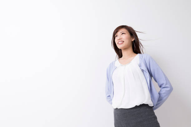 istock A woman blowing in the wind 974828944