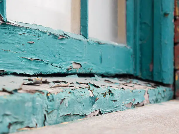 Photo of Peeling paint on old window sill