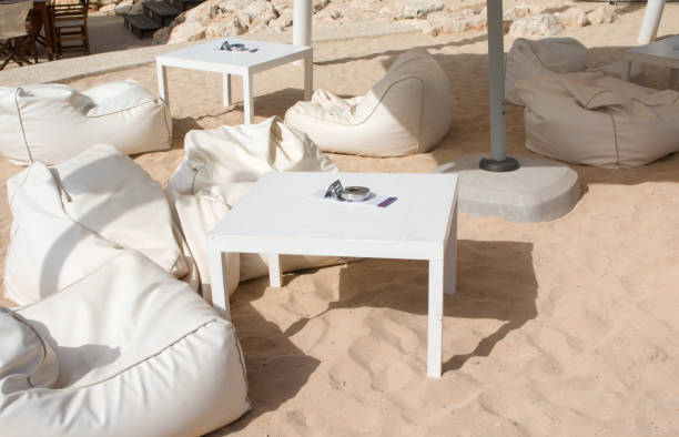 istock Summer outdoor terrace cafe on sand beach 974832912