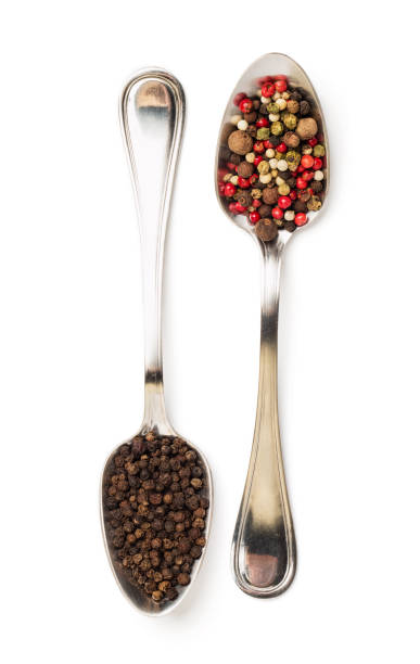 istock Different spices in iron spoons isolated on white 974833228