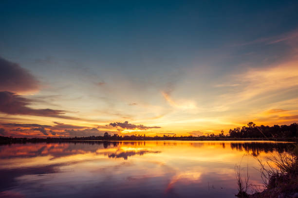 istock sunset on the lake landscape 974851668