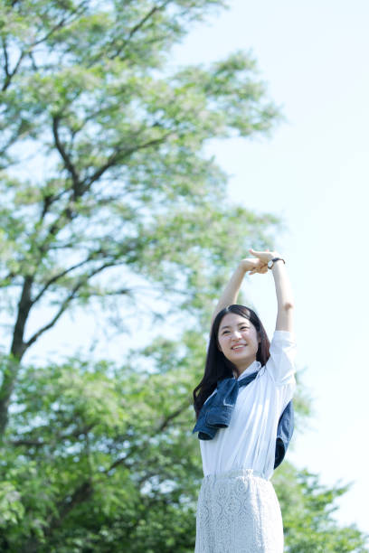 istock A woman standing in the green 974853658