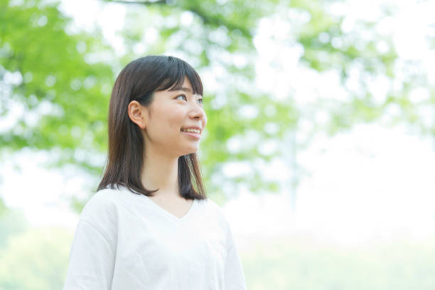 istock A woman standing in the green 974853790