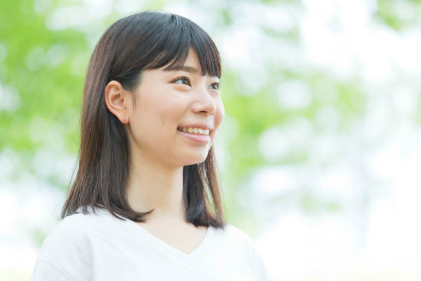 istock A woman standing in the green 974853836