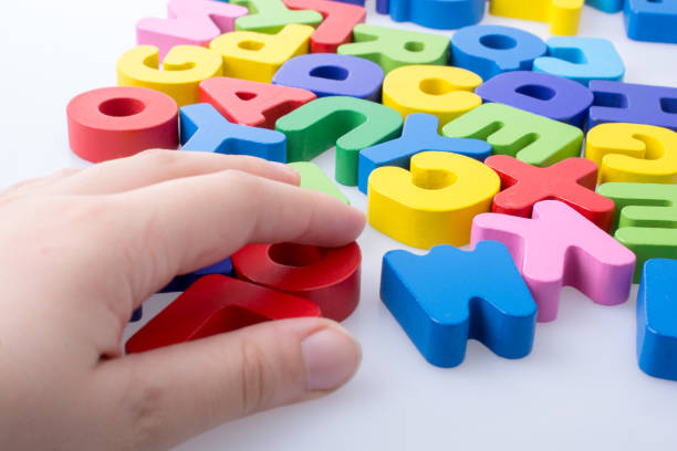 istock Colorful letter blocks scattered randomly on white 974861462