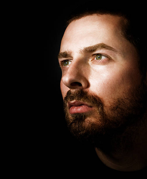 istock Hopeful man looking into the light 97486498