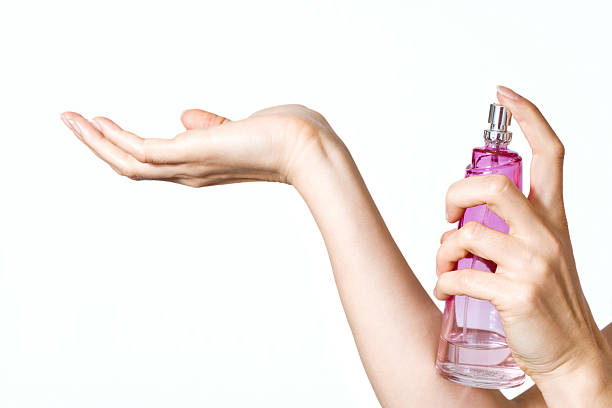 istock Woman hands with pink perfume bottle 97486551