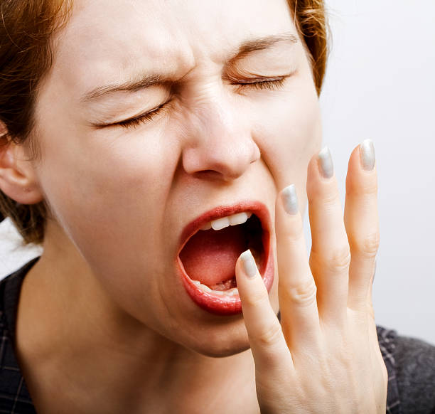istock Sleepy tired woman making a big yawn 97486757