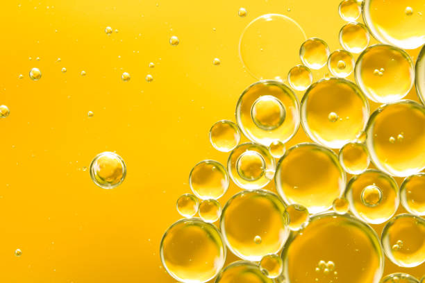 istock golden yellow bubble oil, abstract background 974867738