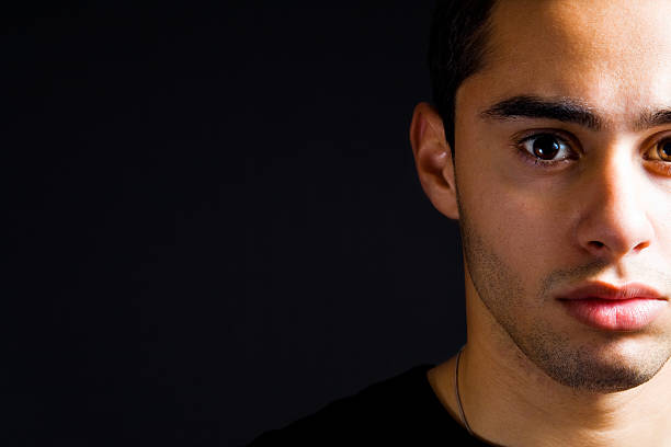 Closeup portrait of serious hispanic man stock photo