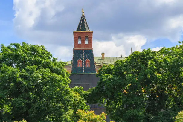 Photo of Komendantskaya tower of Moscow Kremlin on a blue sky background