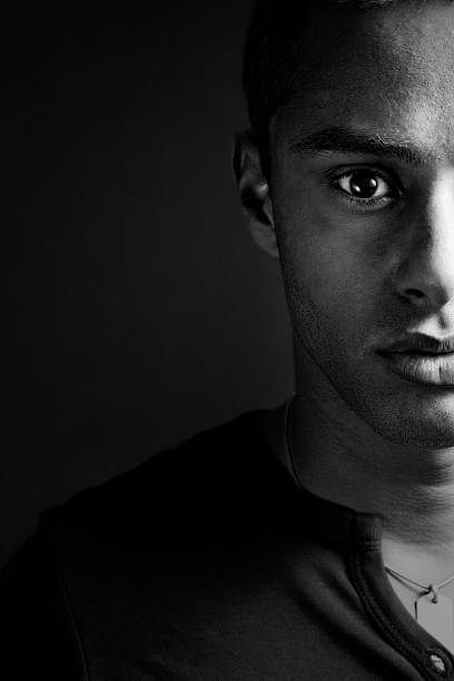 Half face of one sensual masculine black man stock photo