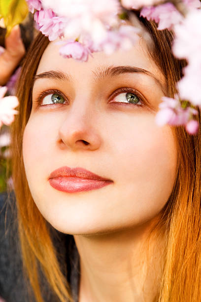 istock Aromatherapy - beautiful woman smelling flowers 97486905
